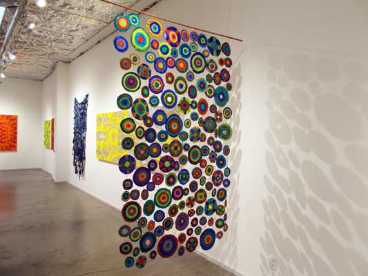 Sewing Circles (2013): installation view (Side 2). 84" x 48". Oil on canvas and wire.
